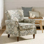 Fauteuil traditionnel Araceli en bois, rembourré à motif floral, avec dossier à oreilles et bordure cloutée| ART OF LIVING DESIGNS