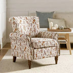 Fauteuil traditionnel Araceli en bois, rembourré à motif floral, avec dossier à oreilles et bordure cloutée| ART OF LIVING DESIGNS