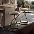Tabouret de bar élégant en cuir beige avec structure métallique dorée